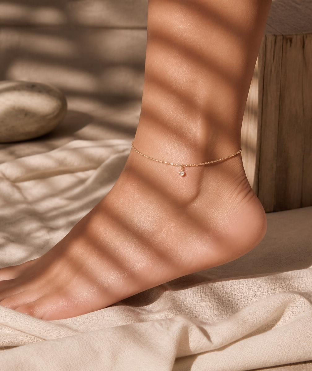 Gold chain anklet on an ankle